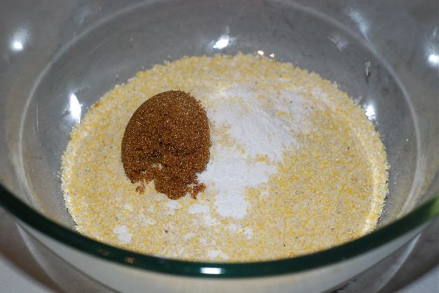 In a medium bowl combine cornmeal, baking soda, and sugar