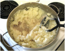 Add the garlic paste, vinegar, salt and pepper