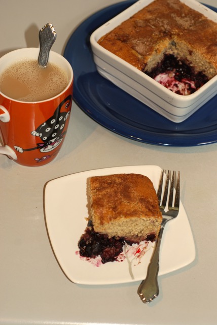 Slice of the Cherry Cobbler with a hot mug of chai tea