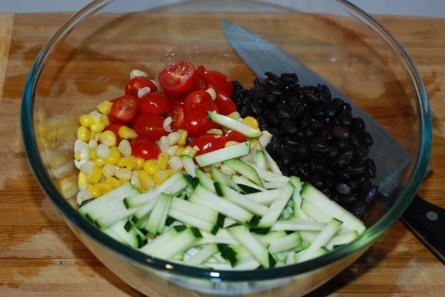 Salad ingredients in a mixing bowl