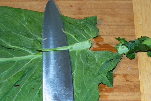 Trimming the spine on the collard greens