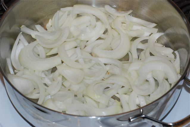 Spread the onions over the bottom of the pan
