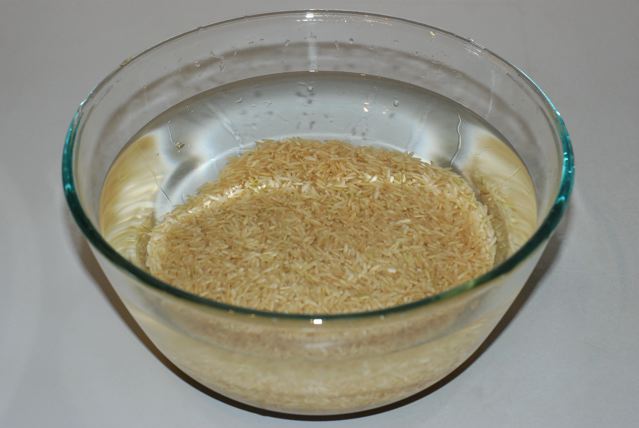 Brown basmati rice soaking in a bowl
