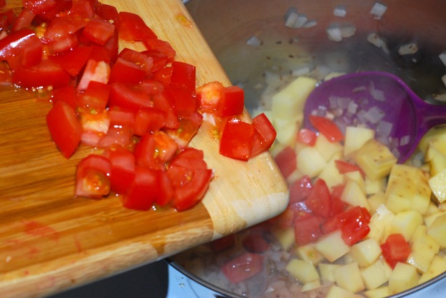 Add the potatoes and tomatoes