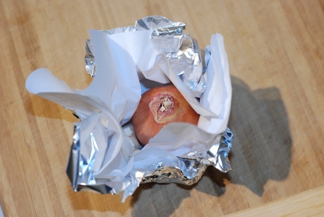 Shallot and garlic wrapped in parchement lined foil foil parcel