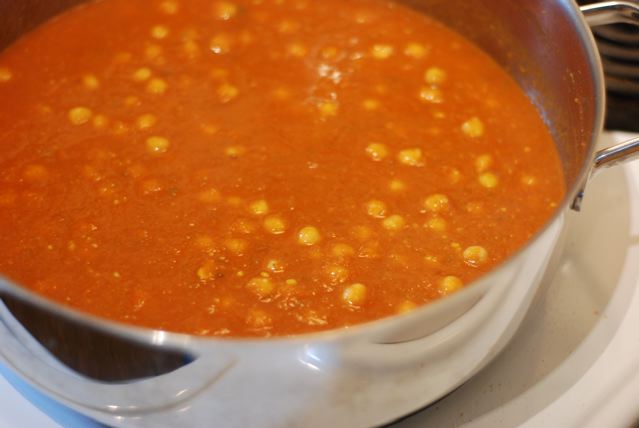 Simmer the chick peas in the tomato gravy
