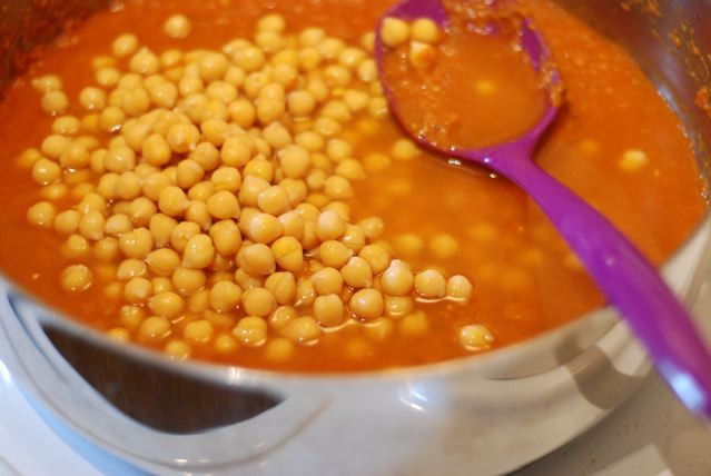 After 5 minutes, add the chick peas and stir 