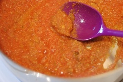 Tomato puree added to the pan