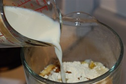 Adding soy milk to the dried mushrooms and cauliflower aready in the blender