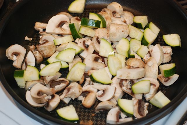 Mushrooms and zucchini in a non-stick pan