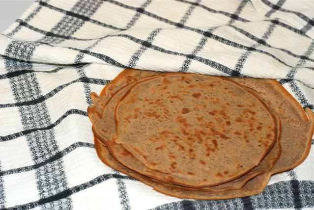 Cooked crepes in folded kitchen towel