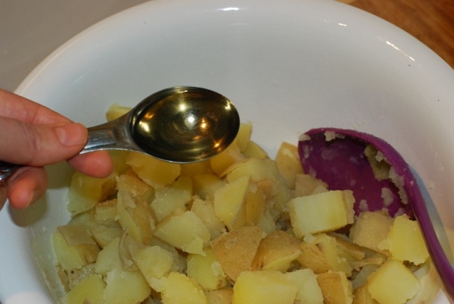 Add vinegar to the potatoes