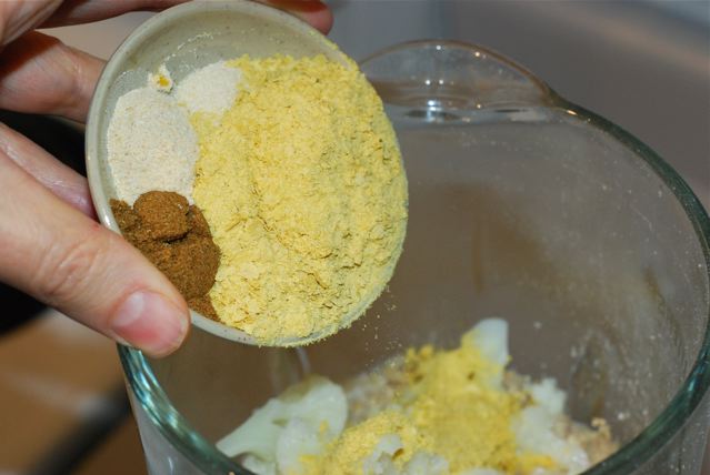 Add nutritional yeast, cumin, garlic powder and onion powder