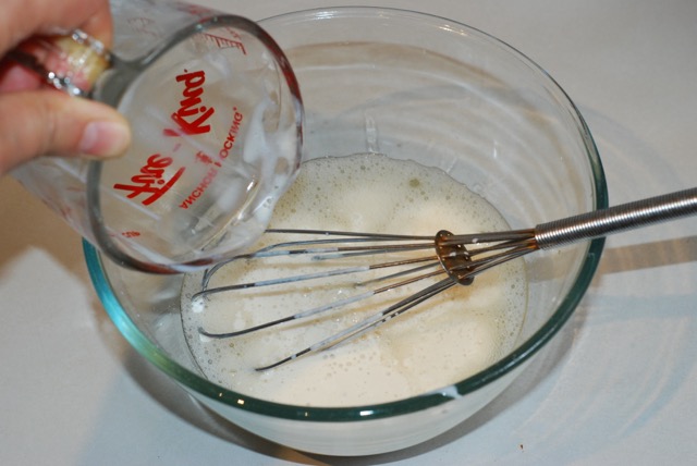 Add sour soy milk to the aquafaba and whisk until frothy