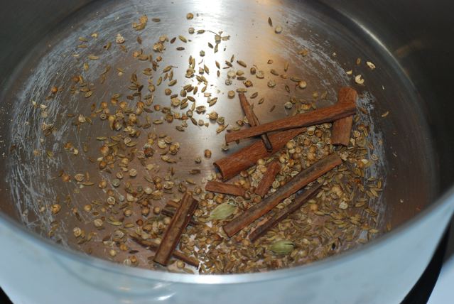 Smashed spice blend dry toasting with the cumin seeds