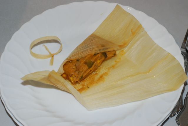 Check the tamal for done-ness