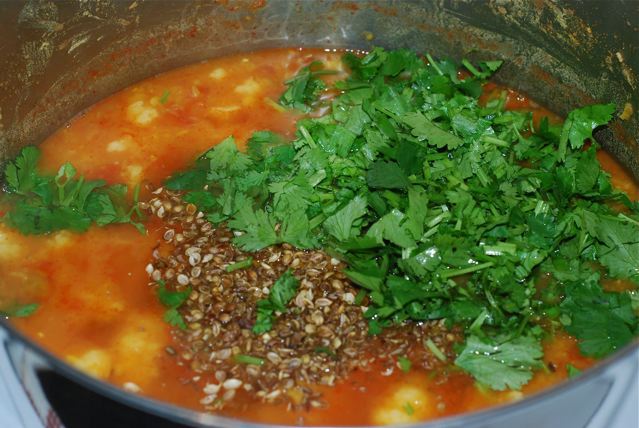 Add the seeds and cilantro to the cooked soup