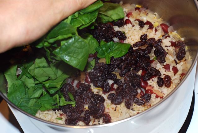 Add the raisins and spinach