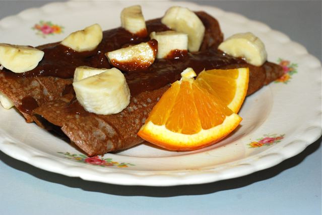 Buckwheat Crepes with Chocoalte orange Sauce served topped with banana and orange slices