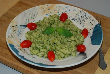 White Bean Pesto served on pasta and garnished with grape tomatoes