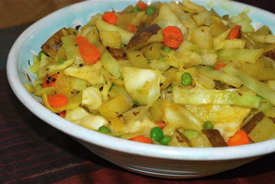 Big serving bowl with Spiced Cabbage and Peas with Potatoes--beansriceeverythingnice@weebly.com
