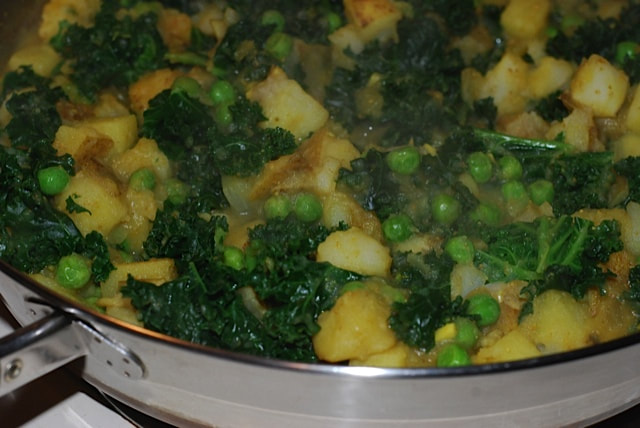 Close-up of the finished dish still in the skillet--North Indian Potatoes and Greens/beansriceeverythingnice@weebly.com