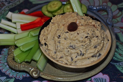 Platter of cut fresh veggies with Black Olive Hummus. / Happy Holidays from beansriceeverythingnice.weebly.com