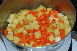 Add the cut vegetables to the cooked lentils