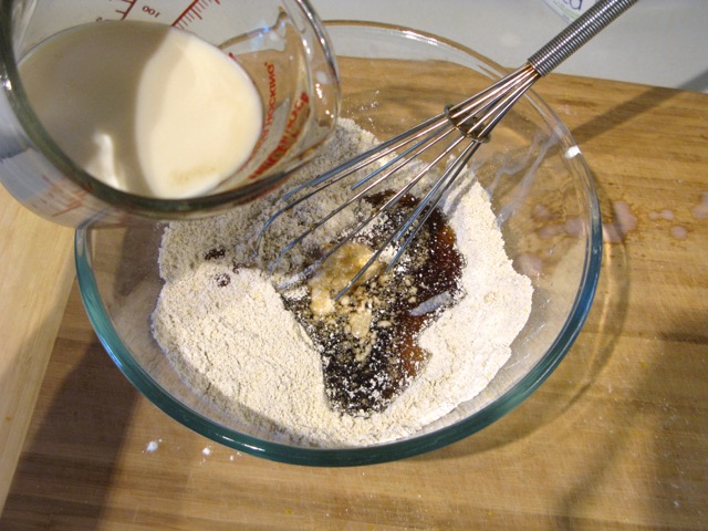 Adding the maple syrup and non-dairy milk to the dry ingredients