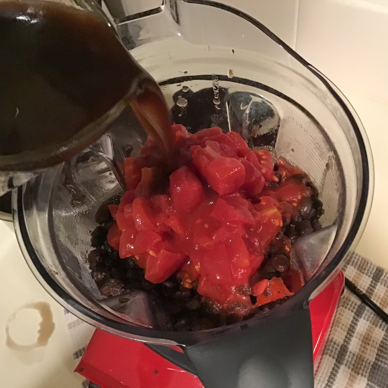 Puree the strained beans along with the can of diced tomatoes and 2 cups of cooking water--Spicy Black Bean Soup--Instant Pot recipe / Fat-Free, Gluten-Free, Vegan--https://beansriceeverythingnice.weebly.com