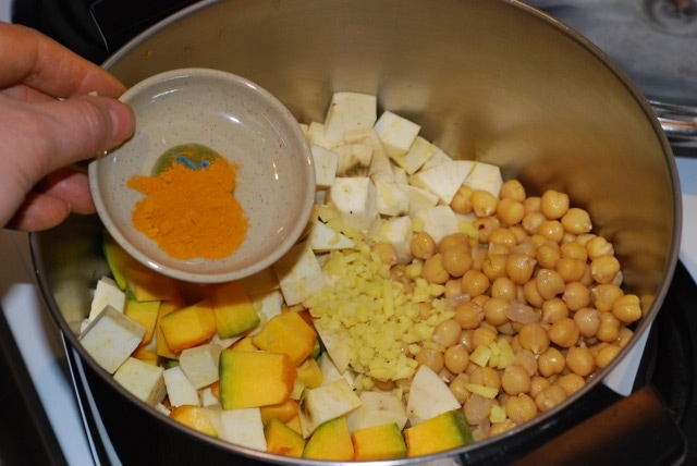 Add squash, sweet potato, chickpeas ginger, turmeric and water to the soup pot