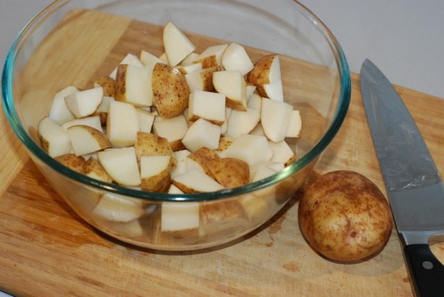 Chopped potatoes in a large mixing bowl