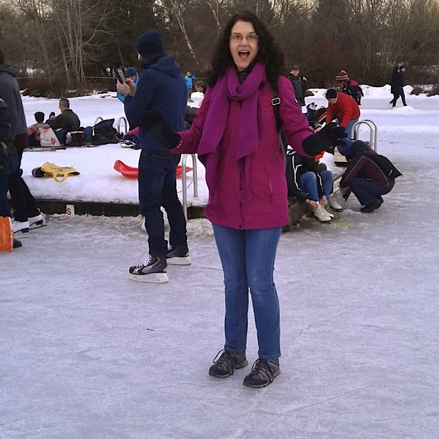 Photo of the author of the blog Beans Rice Everything Nice saying hello while standing on a frozen lake.