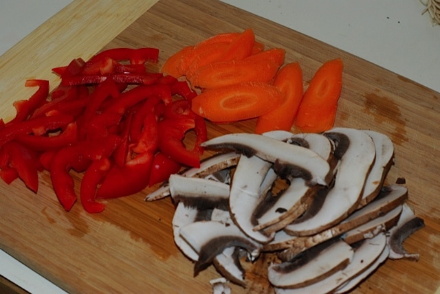 Sliced mushrooms, carrot, and red bell pepper
