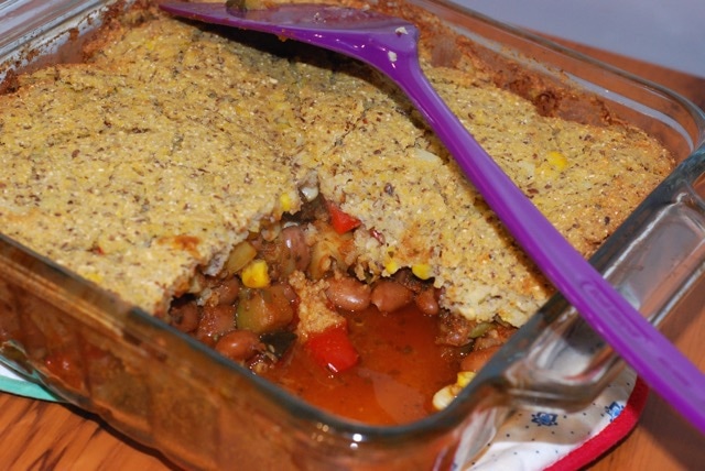 Quick Cornbread Casserole in the baking dish with a serving removed.