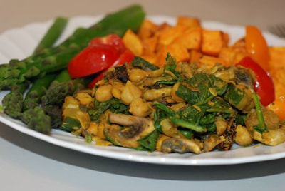 Greek Chickpea Scramble with mushrooms and spinach served with asparagus and roasted sweet ptoato