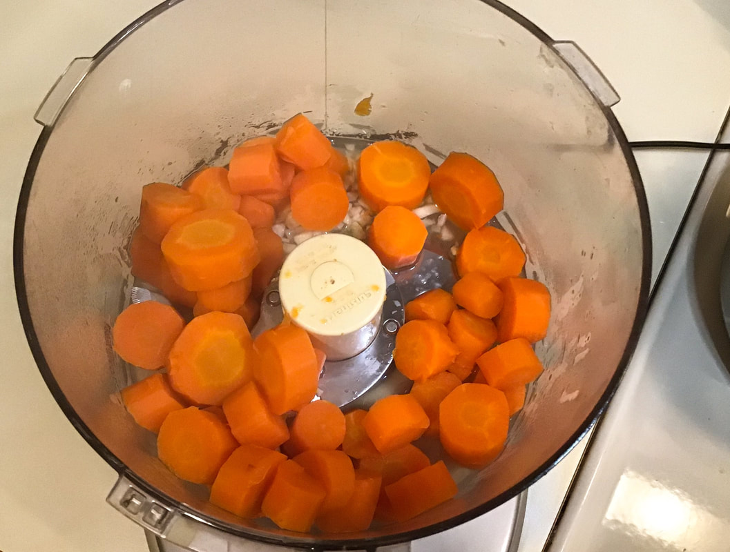 Add cooked carrots to the food processor with lemon juice and garlic—Carrot hummus / Gluten-Free, Oil-Free, Vegan—beansriceeverythingnIce.weebly.com