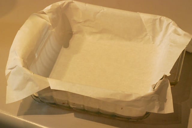 Ine a baking pan with parchment