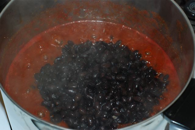 After 5 minutes, add the black beans