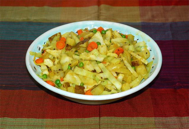 Finished Cabbage and Peas with Potatoes in serving dish
