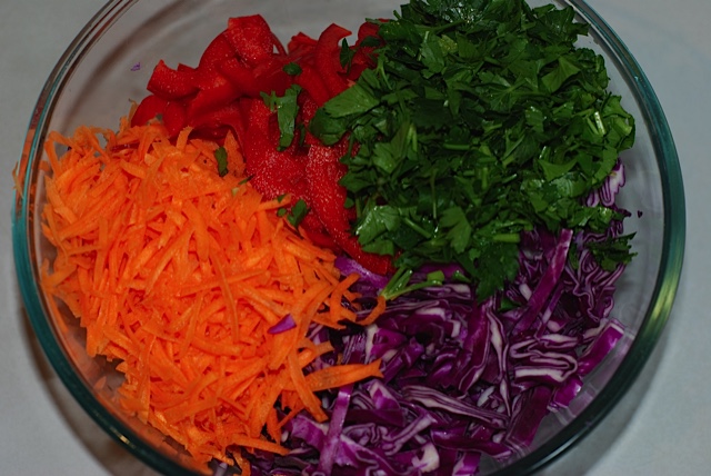 Shredded vegetables in a large salad bowl
