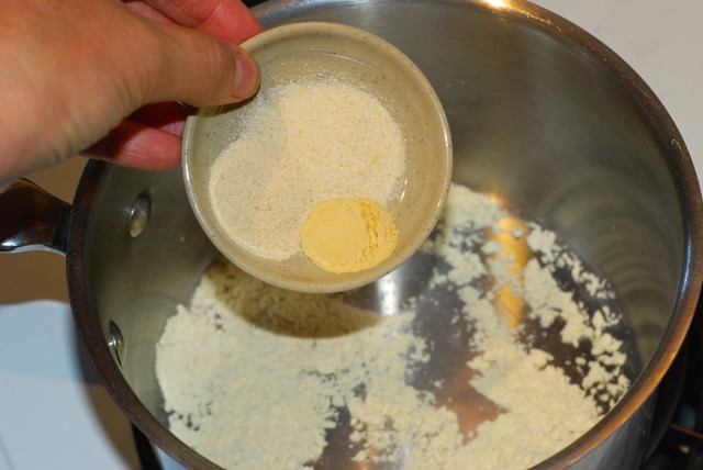 Adding the oinon powder, garlic powder, and dry mustard
