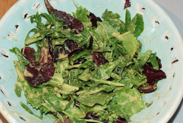 Toss to coat the greens with the dressing
