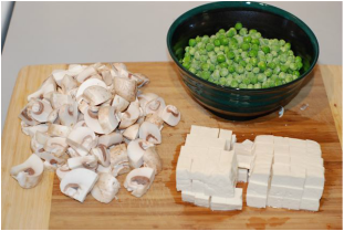 Chopped mushrooms, cubed tofu and frozen peas