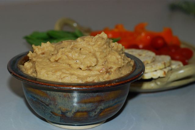 Caramelized Onion Hummus served with fresh vegetables and corn thins