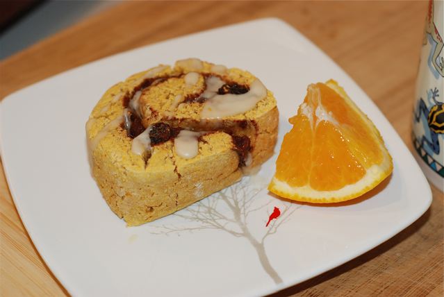 Serve the Cinnamon Roll Biscuit / Fat-Free, Gluten-Free, Mostly Refined Sugar-Free with tea and an orange slice