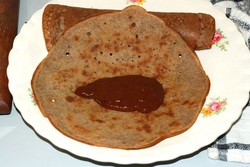 Crepe with a tablespoon of sauce