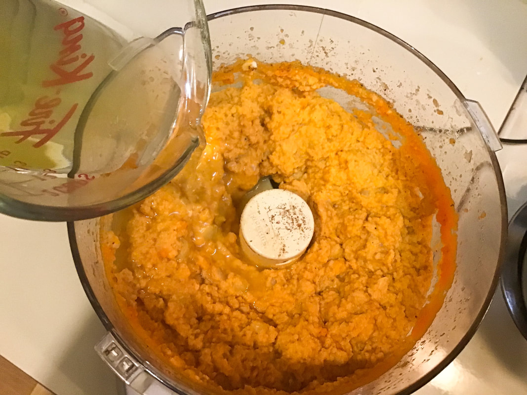 Mixture is too thick, so add the carrot cooking water a little at a time and process until desired consistency is reached—Carrot hummus / Gluten-Free, Oil-Free, Vegan—beansriceeverythingnIce.weebly.com