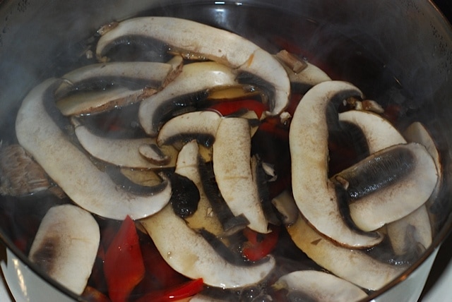 Simmer the mushroom, carrot, and bell pepper in the Shiitake Mushroom Stock