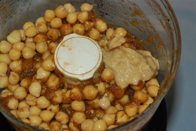 Cooked chickpeas and tahini added to the food processor